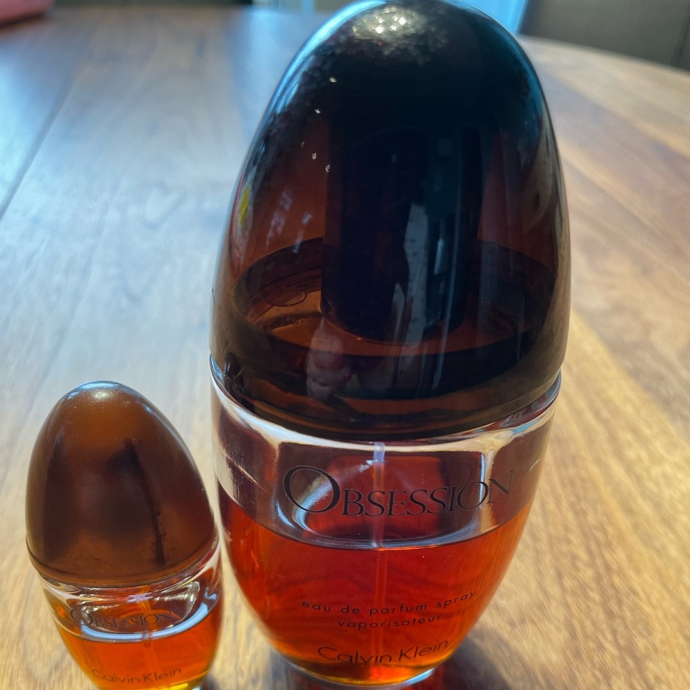 Calvin Klein Obsession 100 ml bottle is half full, small bottle also half full